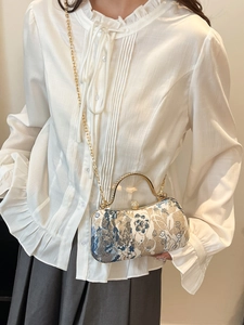 Elegant floral embroidery handbag with gold metal handle and chain strap for women