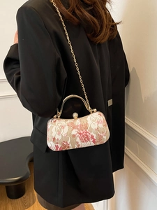 Elegant rose jacquard evening clutch bag with gold handle and rhinestone clasp