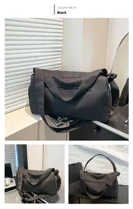 Detailed views of the black waterproof fitness bag showing main zipper and side pockets