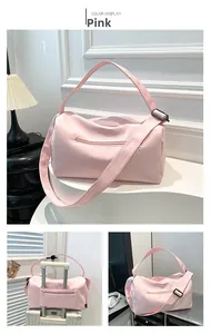 Pink waterproof nylon gym bag with suitcase handle sleeve for travel and yoga use