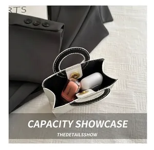 Internal view of minimalist PU tote showing capacity for lipstick and wireless earphones