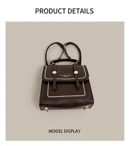 Detail of dark brown retro PU leather backpack with gold buckle and fine stitching