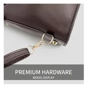 Detail of premium light gold metal hook and dark brown leather shoulder strap joint
