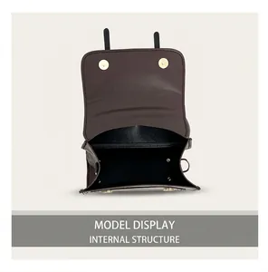 Top view of open dark brown PU leather crossbody bag showing spacious black inner compartment