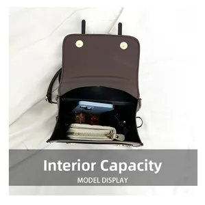 Interior view showing the large capacity for phone, wallet, and perfume in the bag