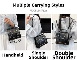 Detail of black crossbody bag showing versatile carrying styles with gold hardware