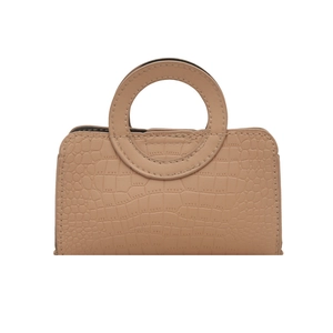 Mini faux crocodile leather handbag in nude pink with a modern circular handle design