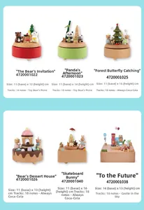 Detail of wooden music box collection featuring hand-painted bears and buses on real wood base