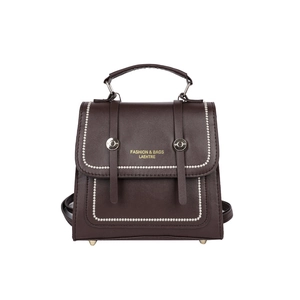 Deep brown vintage leather backpack with top handle and gold-tone hardware details