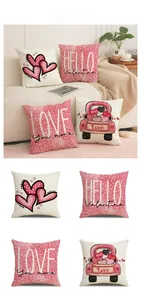 Detailed view of linen Valentine pillow covers featuring heart patterns and holiday slogans