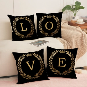 Set of four black and gold LOVE linen cushion covers with laurel wreath for sofa decor