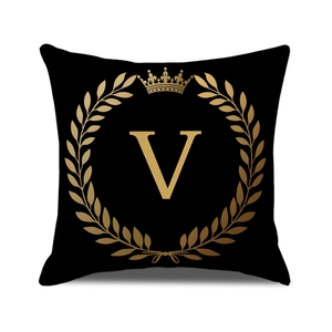 Black and gold square pillow case with crown, laurel wreath and letter V printing