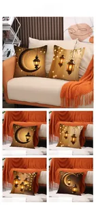 Detail view of 4 decorative pillowcases with golden moon and lantern prints for Eid decor