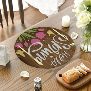 Floral round linen placemat with tulips and butterflies on rustic wood table