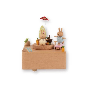 Handcrafted wooden rabbit music box featuring animated picnic scenes and skating bunny