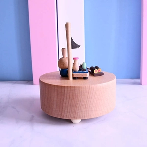 Japanese style wooden music box with rotating rabbit sushi scene handcrafted in beech wood