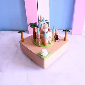 14cm wooden music box featuring a castle and cute characters on a natural wood base