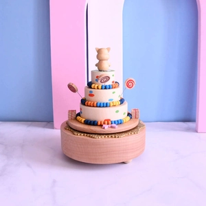 Three-layer wooden birthday cake music box with cute cat figurine and colorful beads