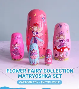 Detailed five-piece wooden fairy nesting dolls in pink and blue floral patterns