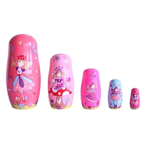 Set of five wooden nesting dolls featuring pink fairy and butterfly princess designs