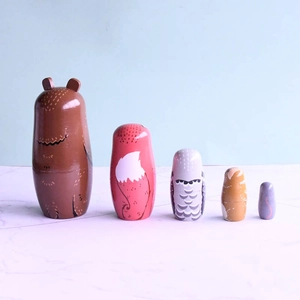 5-piece wooden nesting dolls featuring hand-painted forest animals like bear and fox