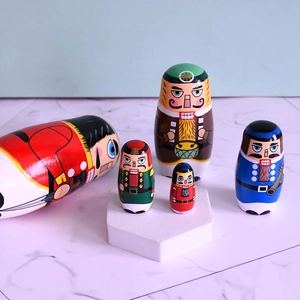 5-piece wooden nutcracker nesting dolls set with colorful hand-painted soldier designs