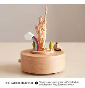 Macro detail of wooden music box showing Statue of Liberty and rainbow carving