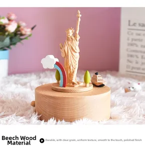 Macro detail of wooden music box showing Statue of Liberty and rainbow carving