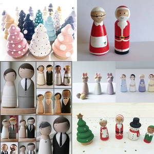Detailed close-up of hand-painted wooden peg dolls featuring various creative themes