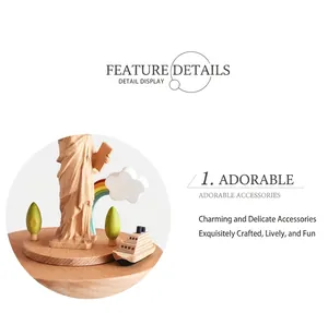 Detail of wooden Statue of Liberty music box with a miniature ship and rainbow