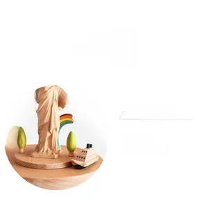 Detail of wooden Statue of Liberty music box with a miniature ship and rainbow
