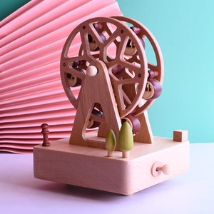 Rotating Ferris wheel wooden music box with natural wood grain for a festive gift