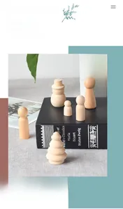 Macro shot of unfinished smooth wooden peg dolls for DIY painting and art crafts