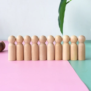 Row of 10 smooth natural unfinished wooden peg dolls for DIY painting and kids crafts