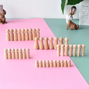 Various sizes of unfinished wooden peg dolls for DIY painting and nursery crafts