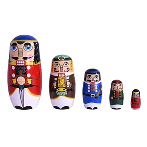 Set of 5 wooden Nutcracker nesting dolls featuring colorful hand-painted soldier designs