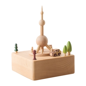 Handcrafted wooden Oriental Pearl Tower music box with miniature trees and vintage car model