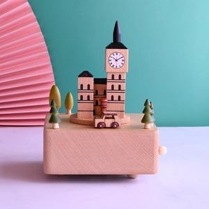 Detail of wooden Big Ben music box with a rotating miniature car on a clock tower base
