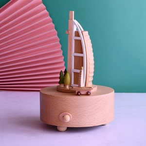 Handcrafted wooden Burj Al Arab music box with miniature trees and car for travel souvenir