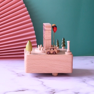 European Arc de Triomphe wooden music box with miniature trees and cars on base