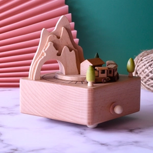 Handcrafted wooden Alishan train music box featuring miniature mountains and trees