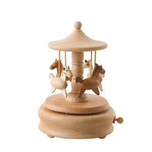 Minimalist wooden carousel music box with natural wood grain finish and four carved horses