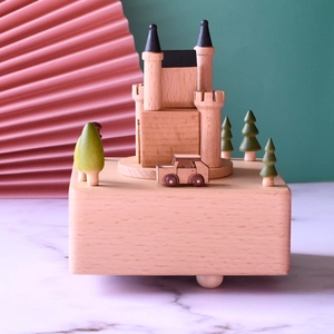 European castle beech wood music box with a miniature car and trees on a wooden base