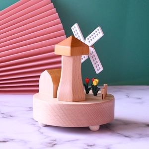 Dutch windmill music box with wooden houses and tulips on revolving base