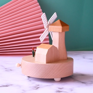 Handcrafted wooden music box with Dutch windmill and tulip design on a smooth base