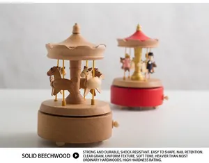 Detailed close-up of beech wood musical carousel box with mechanical wind-up knob