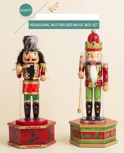 Detail of wooden nutcracker music box figures on red hexagonal bases for Christmas