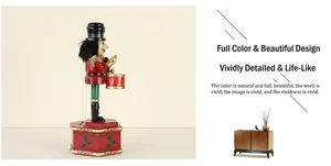 Detail view of 36cm wooden nutcracker drummer with red uniform on hexagonal base