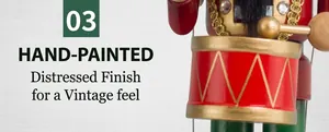 Detail view of the hand-painted snare drum on a vintage red nutcracker soldier statue