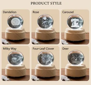 Detail view of 3D laser engraved crystal balls with wooden base and USB power cable